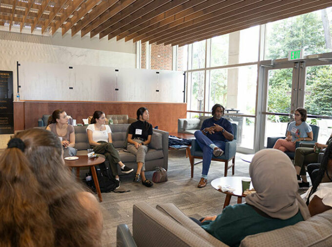 A group seated in a circle with Dean Esters